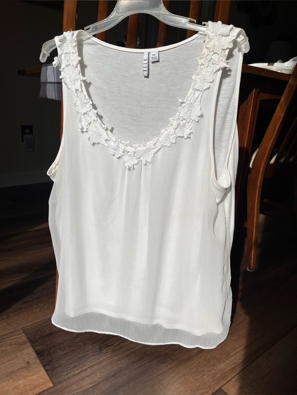 $3 with any ELLE purchase! White tank top with lace neckline!